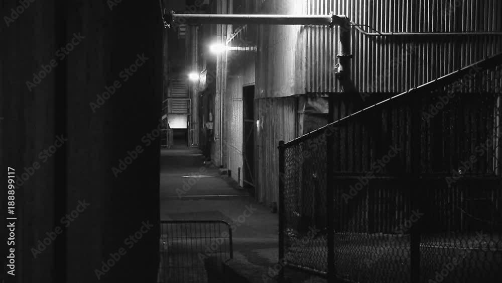 A medium shot of a tight alley in black and white A medium shot of a tight alley in black and white