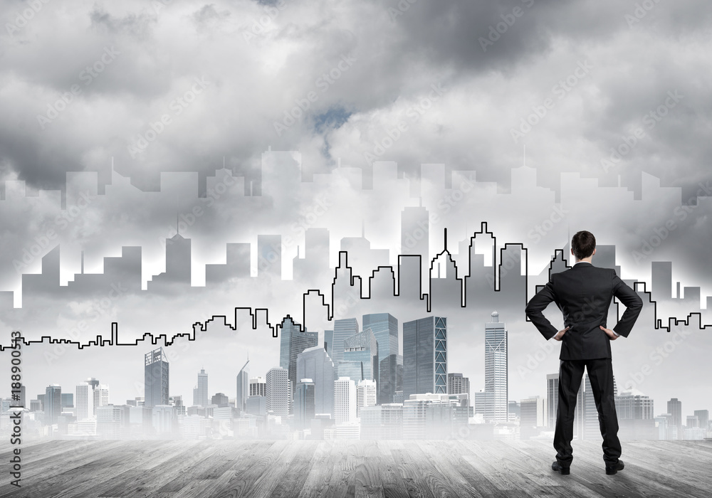 Motivation and inspiration concept with modern cityscape and businessman observing it Motivation and inspiration concept with modern cityscape and businessman observing it