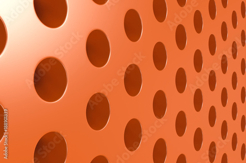 Plain orange surface with cylindrical holes