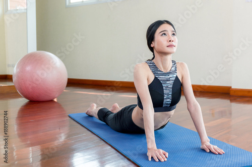 Woman play yoga in fitness.