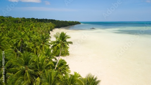 Aerial shot of white deserted tropical beach photo