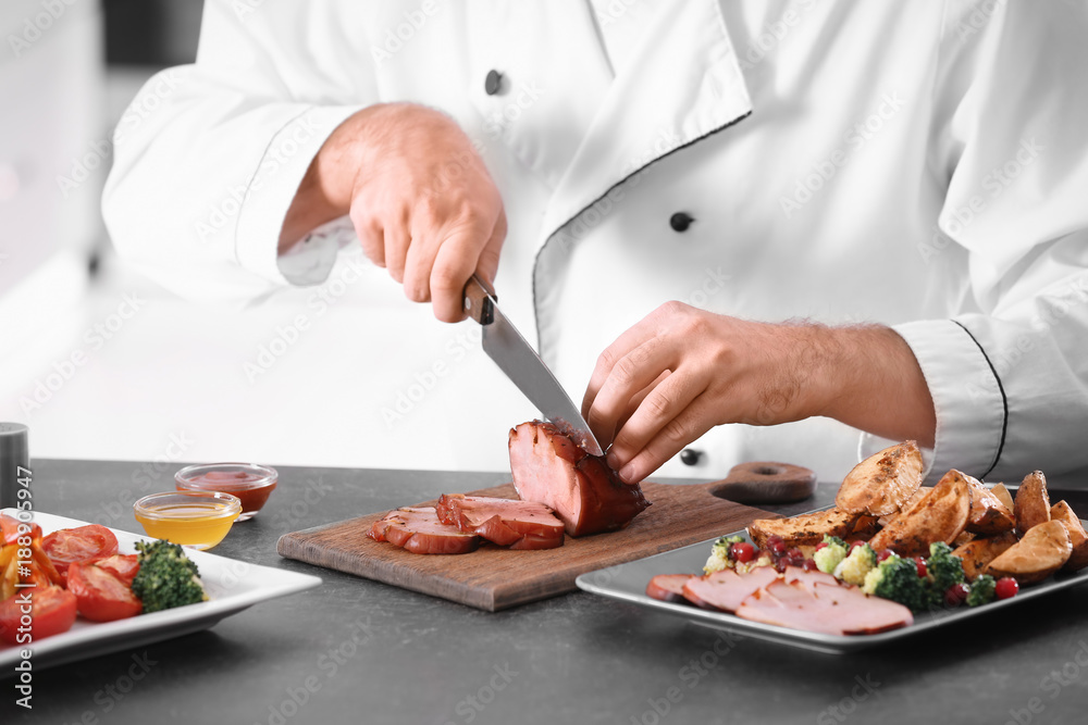Chef slicing yummy honey baked ham on wooden board Chef slicing yummy honey baked ham on wooden board
