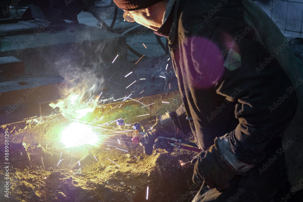 the welder welds metal structures the welder welds metal structures
