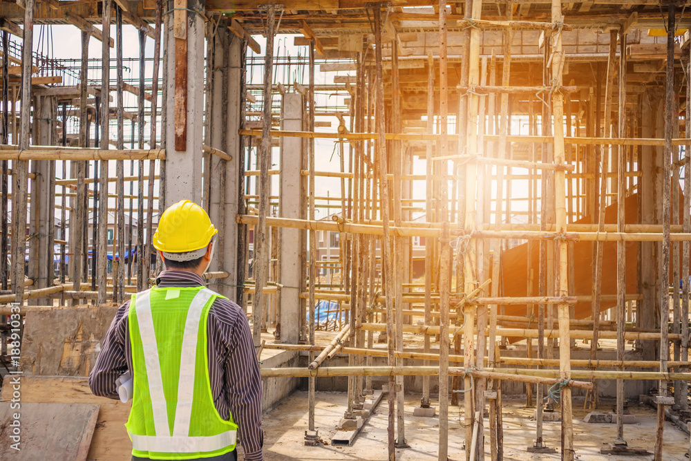 Asian business man construction engineer worker at house building site