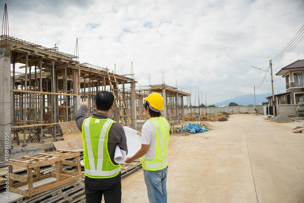 Asian business man construction engineer workers at house building site Asian business man construction engineer workers at house building site