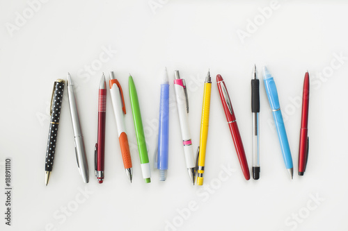 Different colour, type, pen and pencil on white background photo