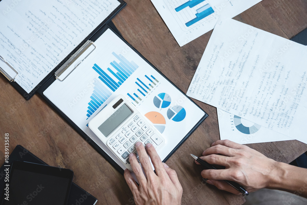 Naklejka premium Co working conference, Business team meeting present, investor colleagues discussing new plan financial graph data on office table with laptop and digital tablet, Finance, accounting, investment