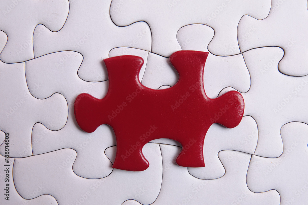 Red puzzle on white background. Copy space