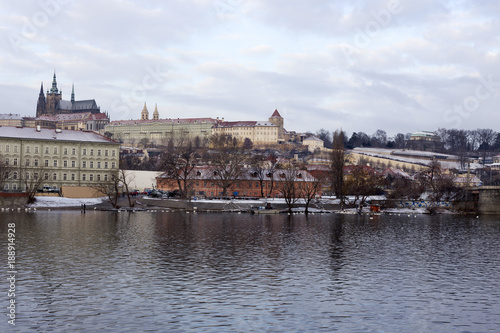 Snowy Prague Lesser Town with gothic Castle above River Vltava, Czech republic © Kajano