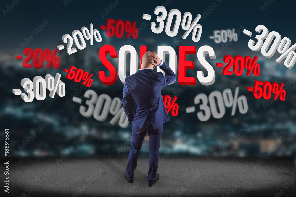 Businessman in front of a wall with sales promotion 20% 30% and 50% flying on an interface - Shopping concept Businessman in front of a wall with sales promotion 20% 30% and 50% flying on an interface - Shopping concept