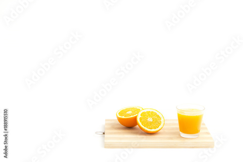 Half orange and a glass of juice