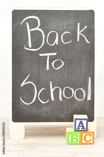 Fototapeta Naklejka Na Ścianę i Meble -  A blackboard with the words Back to School with alphabet blocks ABC
