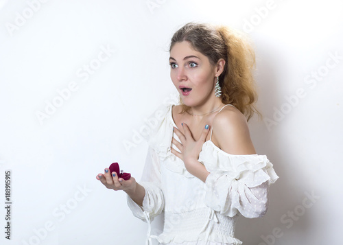 attractive surprised girl receive engagement ring