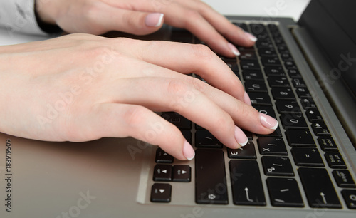 Female hands on the keyboard