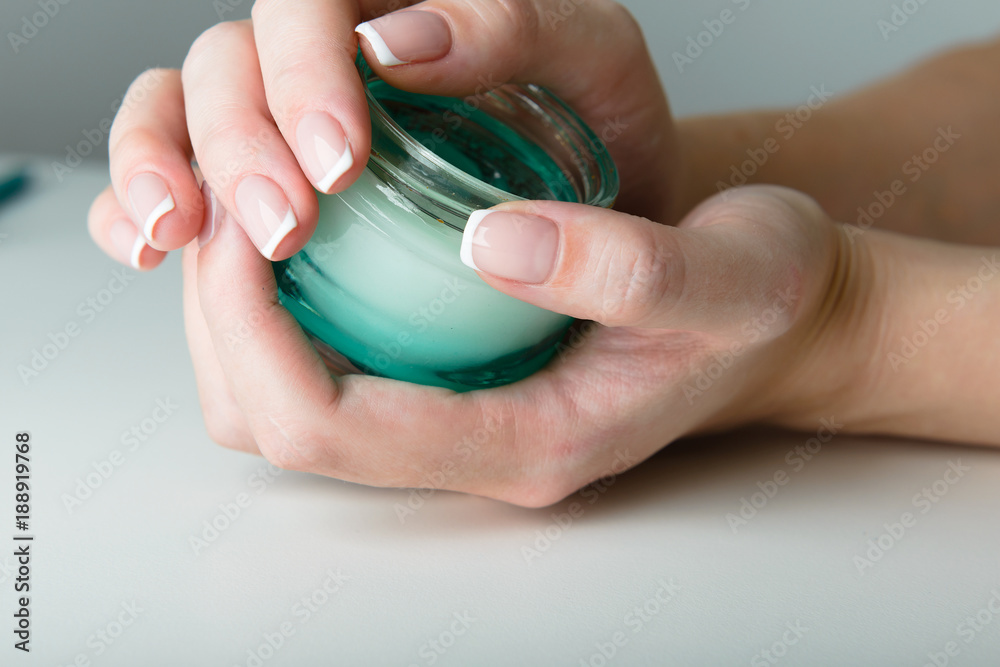 beautiful woman hands with cream beautiful woman hands with cream
