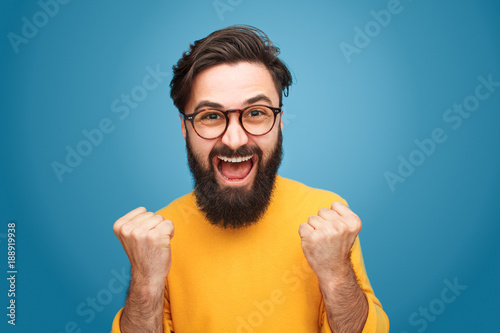 Excited man with fists up photo