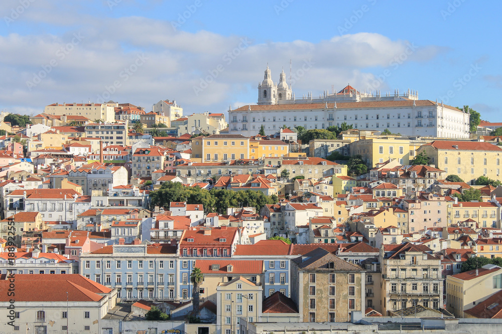 Cityscape of Lisbon, Portugal.  Brightly Coloured Buildings.  Monastery of Sao Vicente de Fora on Skyline