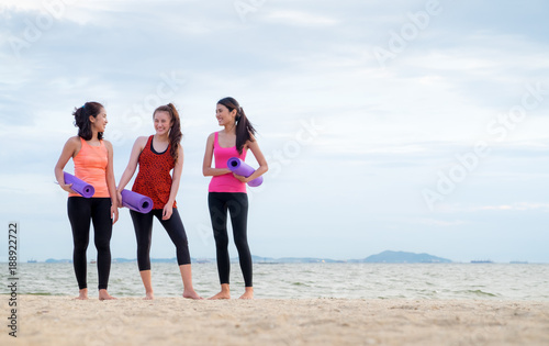 yoga student talking after finish outdoor beach training class,Healthy balance lifestyle sport concept