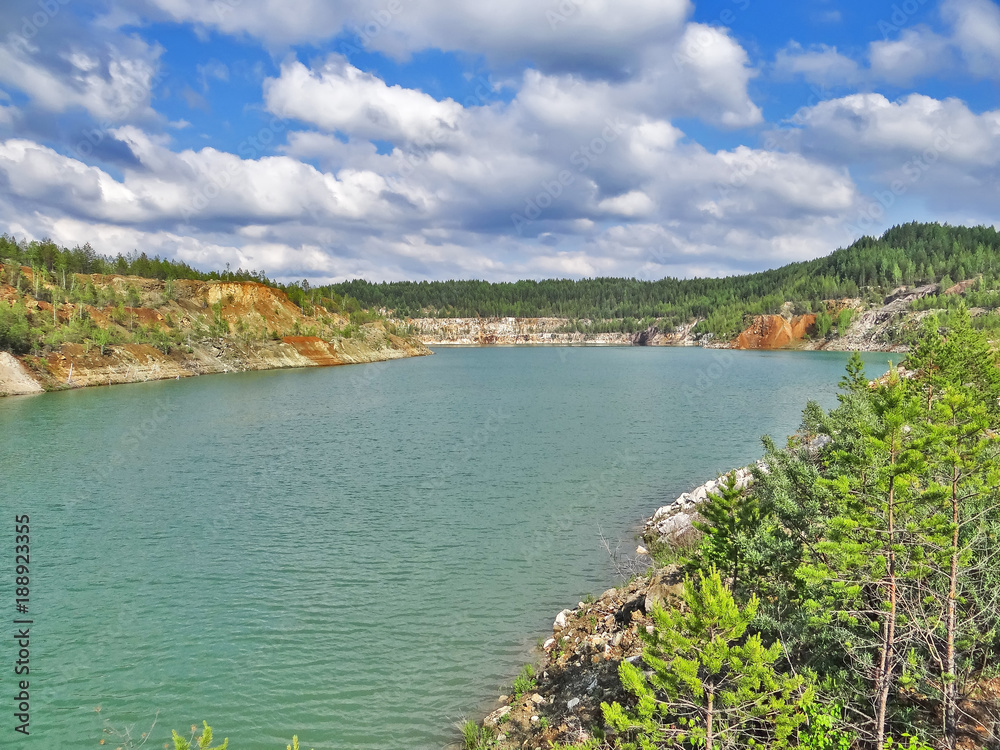 The turquoise quarry lake. Lipovsky quarry. Sverdlovsk region. Russia