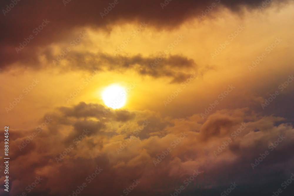 Sunrise shines through a orange thunder clouds Sunrise shines through a orange thunder clouds