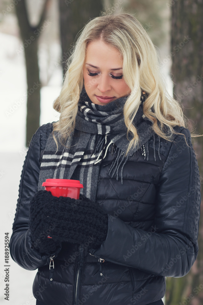 Young attractive woman with a cup of hot drink Young attractive woman with a cup of hot drink