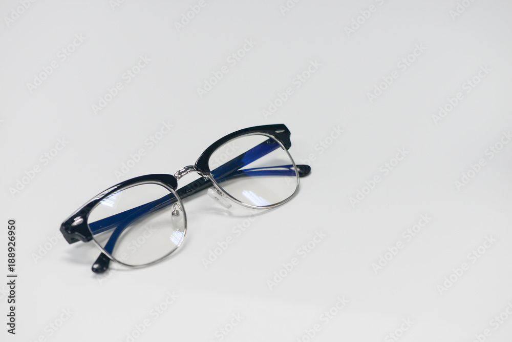 Eyeglass is on the white table Eyeglass is on the white table