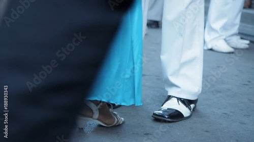 Close up of people dancing in the street in Cuba to Spanish music