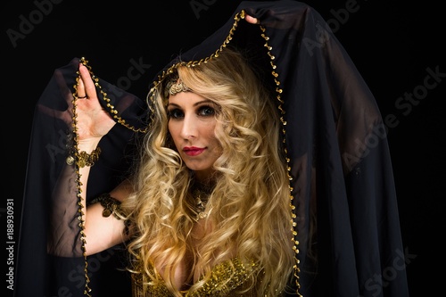 Woman fortune teller portrait on black photo