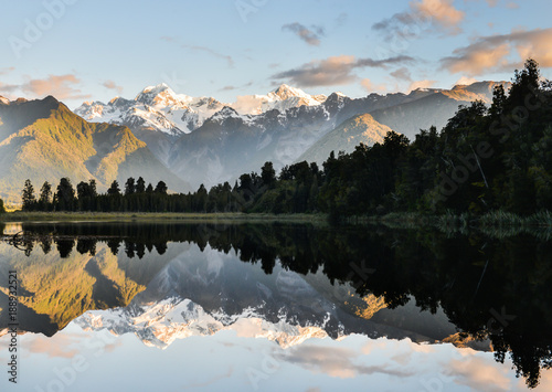 Mt Cook is reflect to the water at Lake matheson in new zealand southland photo