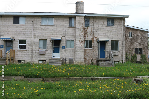  Low income housing with uncut grass and weeds.  Many units are abandoned.