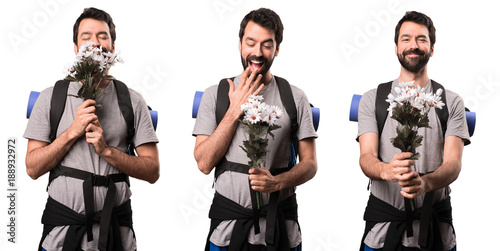 Set of Happy Handsome backpacker holding flowers