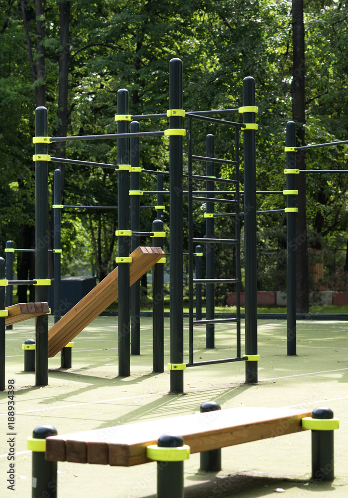 Fototapeta premium Street sports ground. The horizontal bar and benches