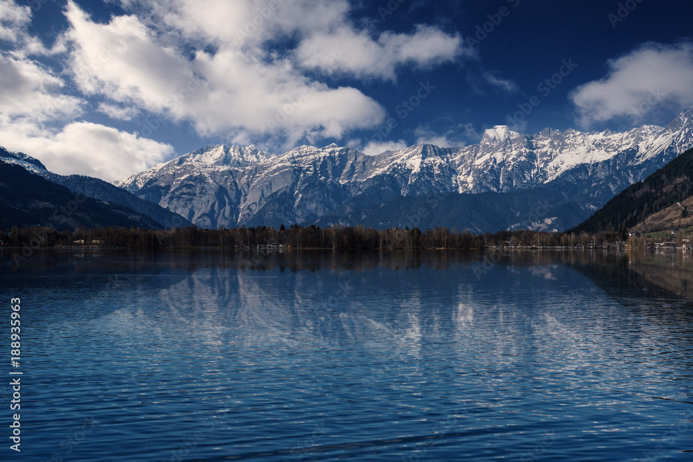 Snowy Mountains reflecting in a lake