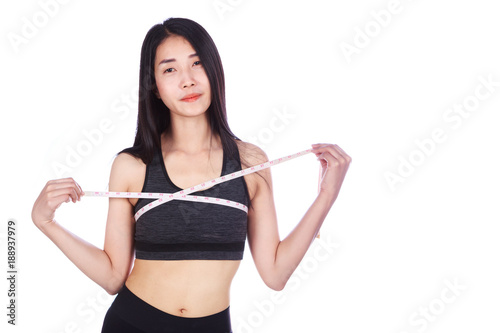 woman is measuring her chest with measure tape isolated on white background © geargodz