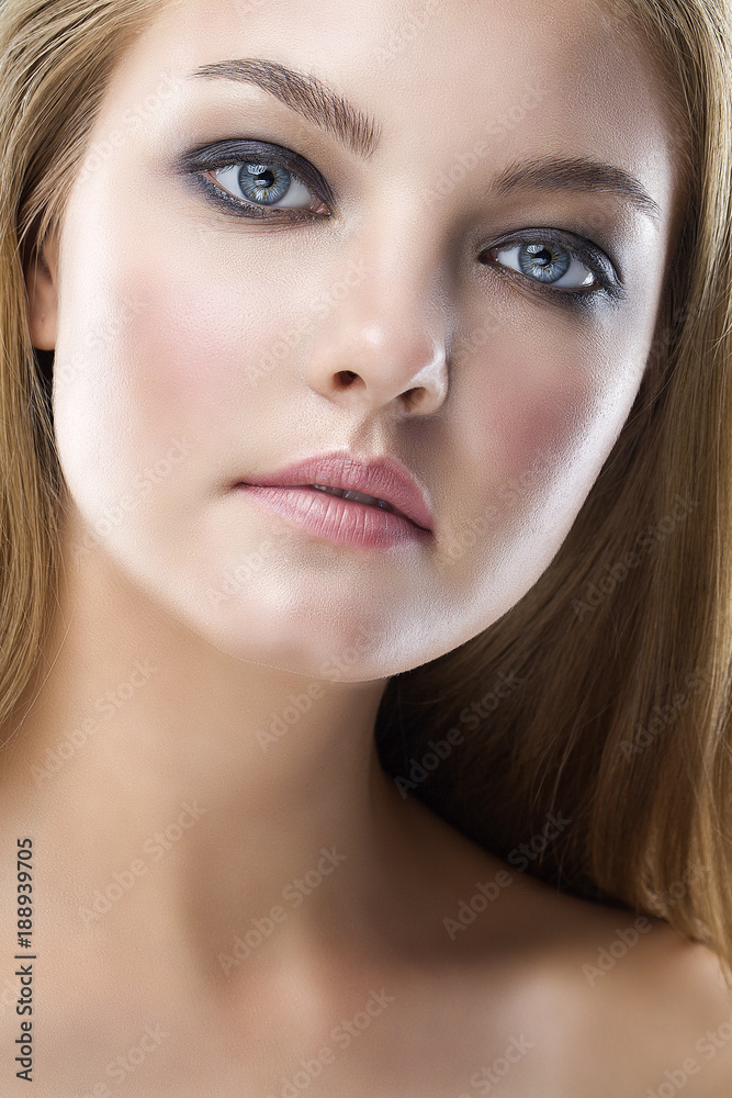 Closeup beauty portrait of young beautiful woman with long straight hair with natural makeup. Hairstyle, skincare and cosmetics concept Closeup beauty portrait of young beautiful woman with long straight hair with natural makeup. Hairstyle, skincare and cosmetics concept