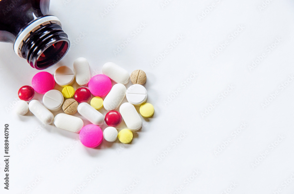 Top view of the pills on the white background, The drug and capsule pills on the floor, Pile of the drug and pills on the white background. Top view of the pills on the white background, The drug and capsule pills on the floor, Pile of the drug and pills on the white background.