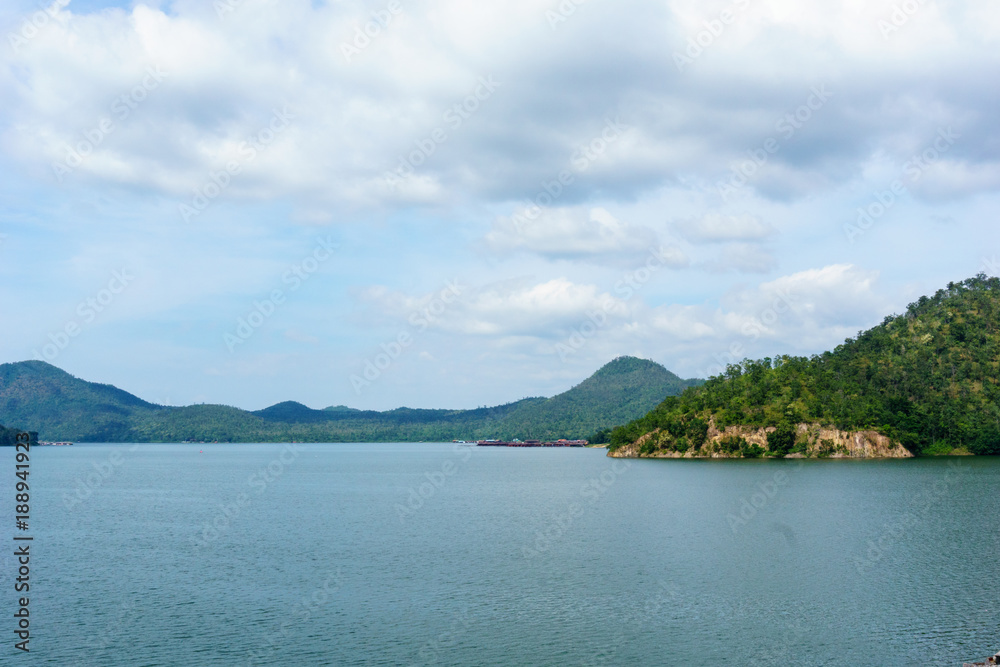 panorama landscape view of amazing beautiful island and water with blue sky and cloud when twilight in srinakarin dam,kanjanaburi,thailand. great scene of nature in the evening.