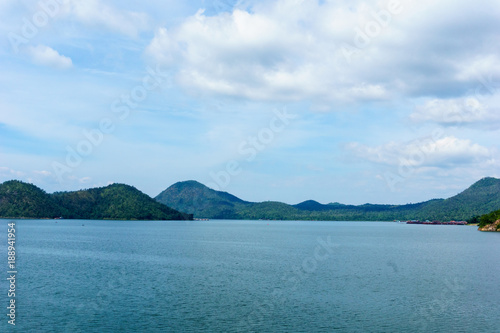 panorama landscape view of amazing beautiful island and water with blue sky and cloud when twilight in srinakarin dam,kanjanaburi,thailand. great scene of nature in the evening.