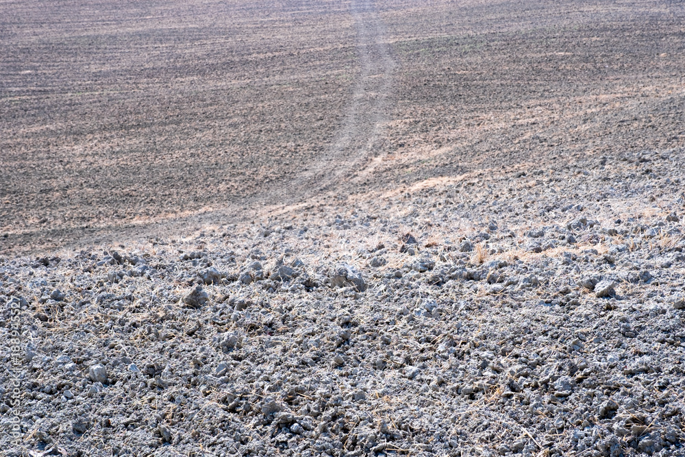 Plowed field ready to be cultivated in Val d'Orcia, Tuscany Plowed field ready to be cultivated in Val d'Orcia, Tuscany