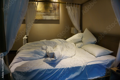 close up of unfinished or messy bed after funny night, sex of new married couple.