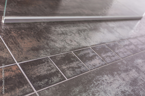 Bathroom floor metallic design tiles