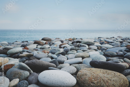 pebble stone beach ocean and blue sky © hanohiki