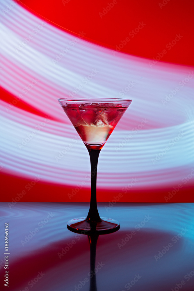 Martini glass with ice against Martini glass with ice against