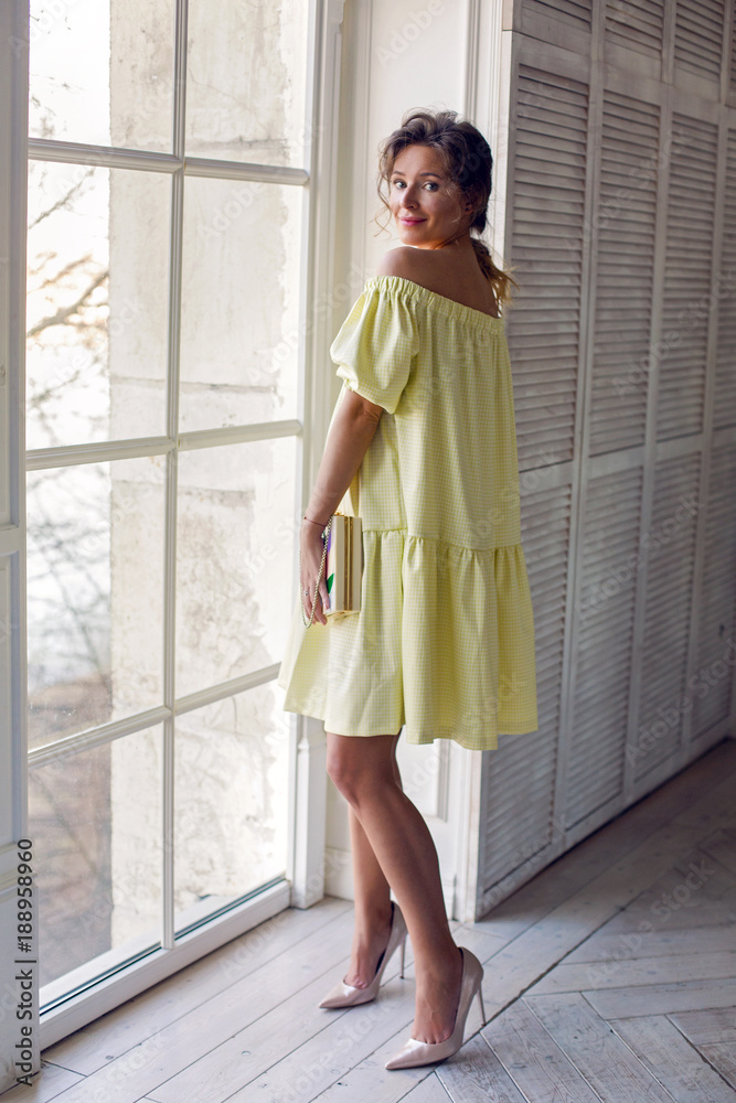 girl in a yellow dress and with a handbag girl in a yellow dress and with a handbag