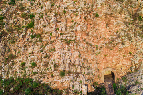 Aerial view on the texture of the rock of red color. The village of Rezevici, on the coast of Montenegro. photo