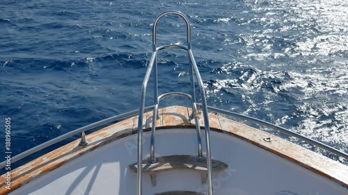 Nose bow of the yacht, boat or ship dissects wave floats on water of lake, river, ocean or sea 4k