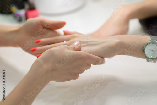 Woman getting nail manicure