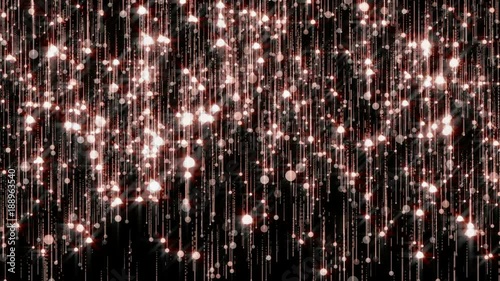 Rose gold glitter particles slow down. Glowing sparkles background. 