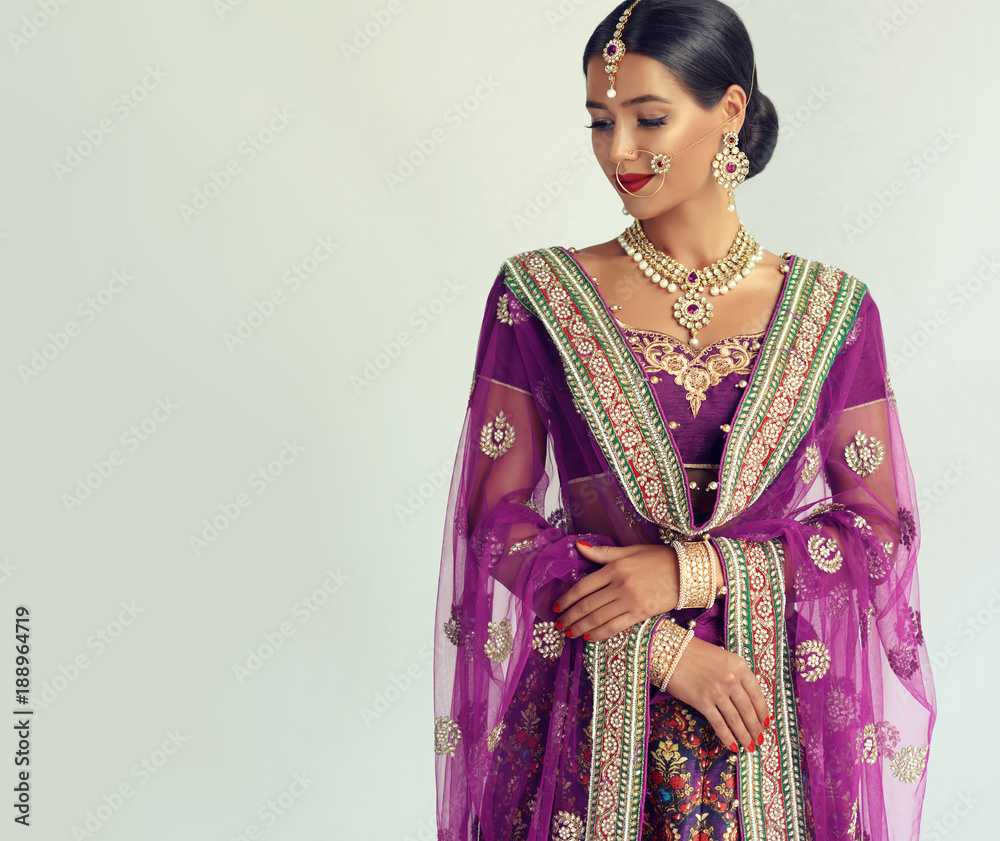 Portrait of beautiful indian girl. Young hindu woman model with kundan  jewelry set. Traditional India costume lehenga choli or sari Stock Photo |  Adobe Stock