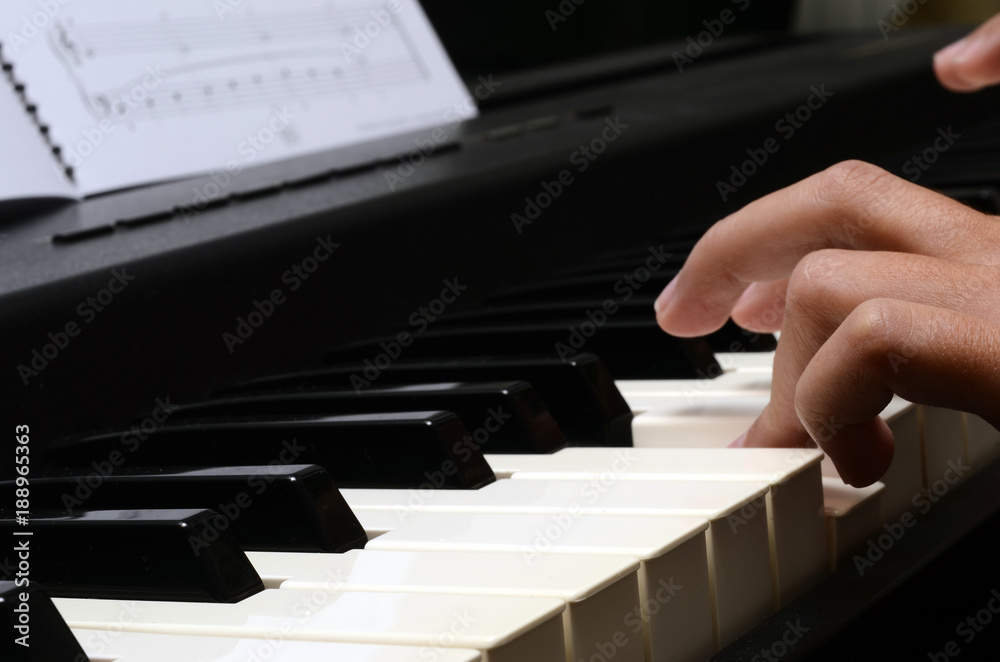 Fototapeta premium Child hands on piano keyboard